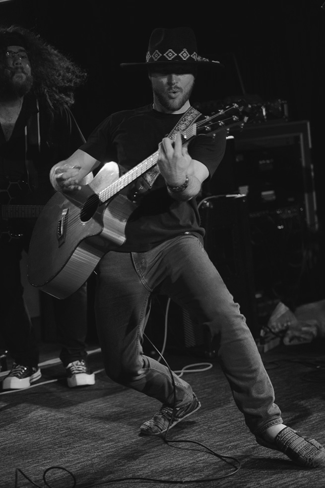 woman playing electric guitar