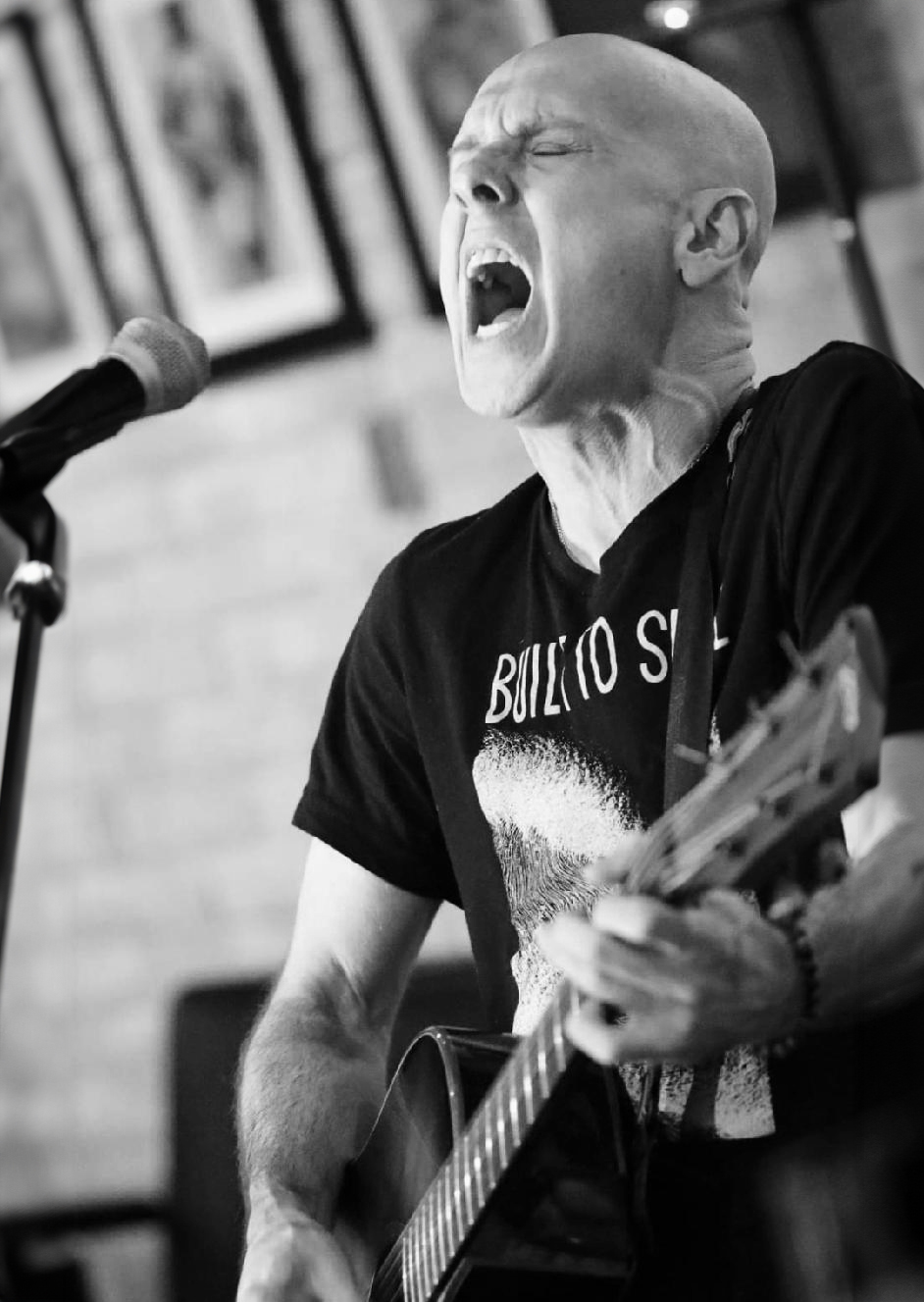 woman playing electric guitar